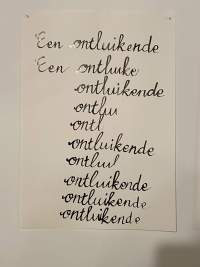 A white A4 sheet is stuck to a wall. 