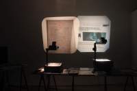 Exhibition installation view. Zone Collective (Kirila Cvetkovska and Megan Hoetger), *Shadow Zones: Experimental Cinema*
*History in Yugoslavia; or, a Cinema and*
*a History Made and Unmade by Maps*, When Site Lost the Plot, Amsterdam, July - October 2021. Photo: Quenton Miller, courtesy of When Site Lost the Plot.