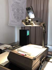 Exhibition installation view. Zone Collective (Kirila Cvetkovska and Megan Hoetger), *Shadow Zones: Experimental Cinema*
*History in Yugoslavia; or, a Cinema and*
*a History Made and Unmade by Maps*, When Site Lost the Plot, Amsterdam, July - October 2021. Photo: Quenton Miller, courtesy of When Site Lost the Plot.